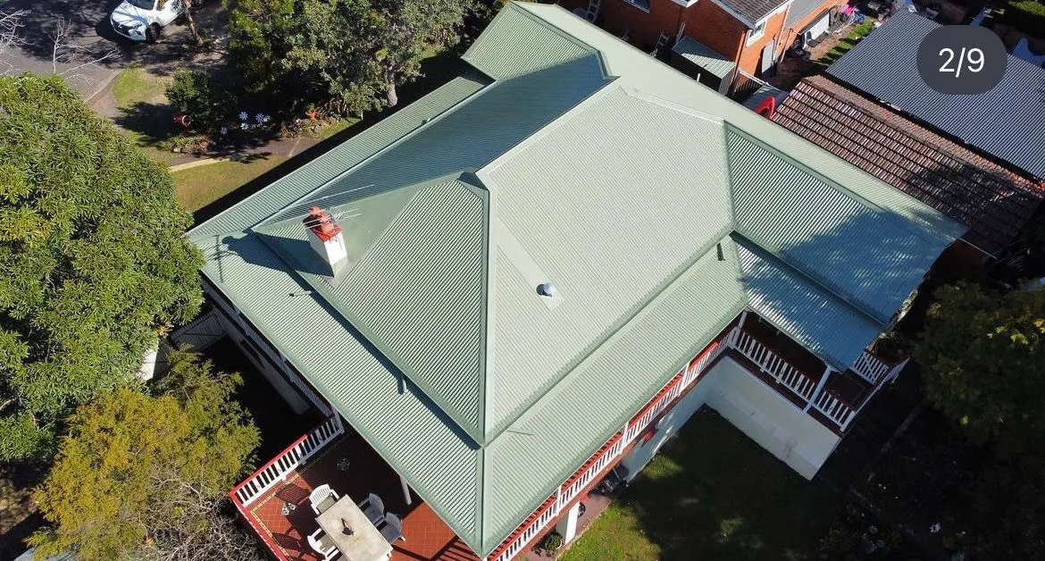 Aerial view of house with green roof.