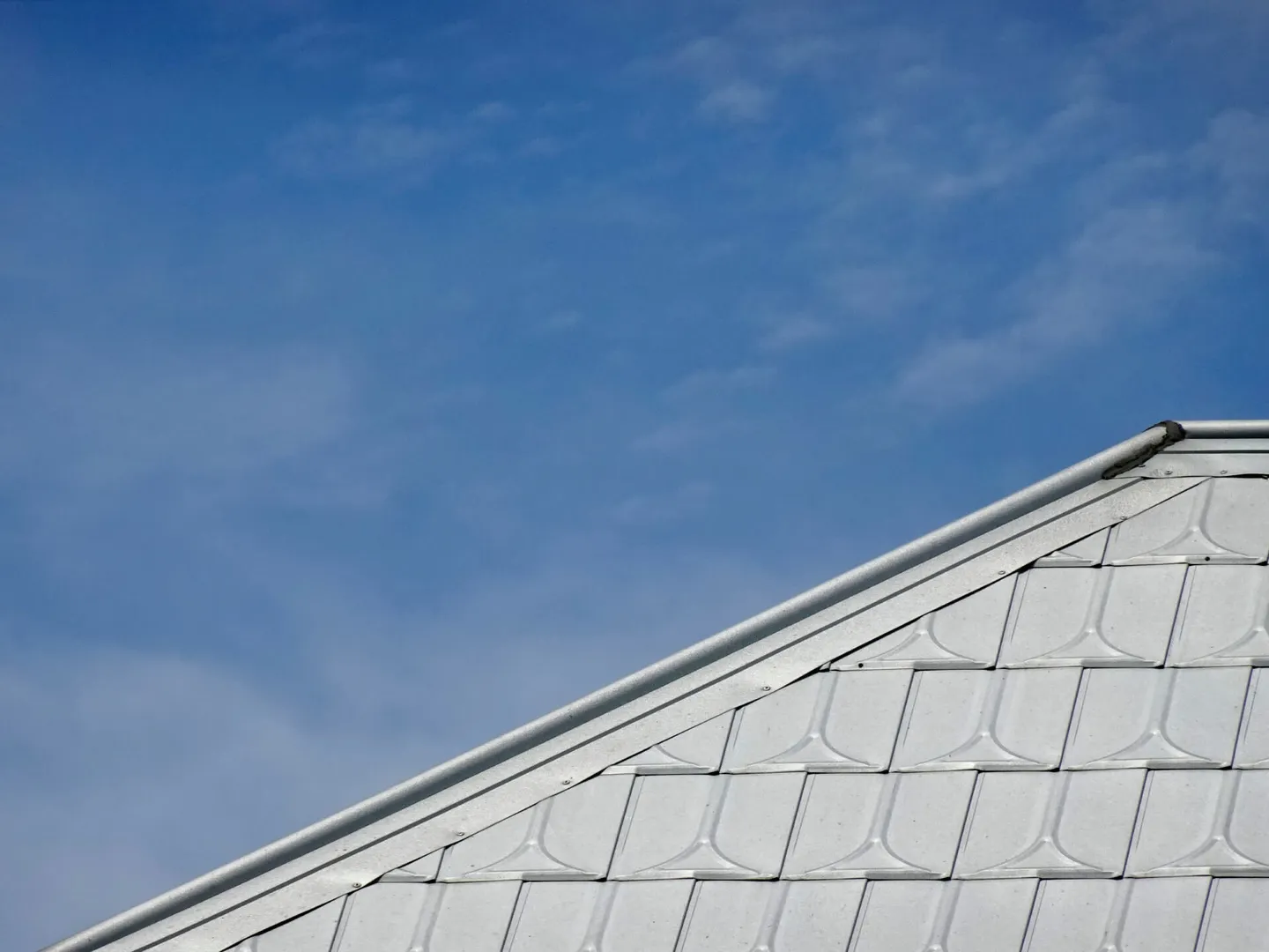Metal roof against blue sky background